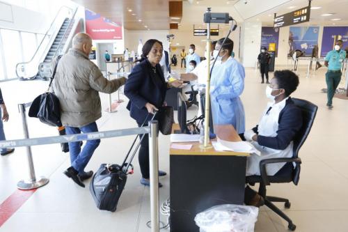 Some passengers going through checks after arriving at the Kotoka International Airport.