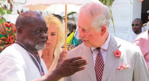Azumah Nelson welcoming Prince Charles to the Bukom Boxing Arena